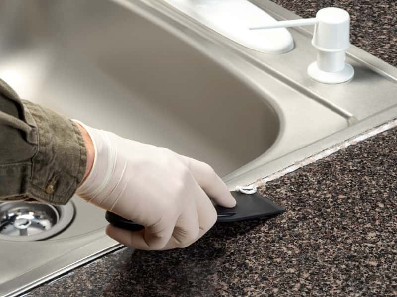 fix seal around kitchen sink