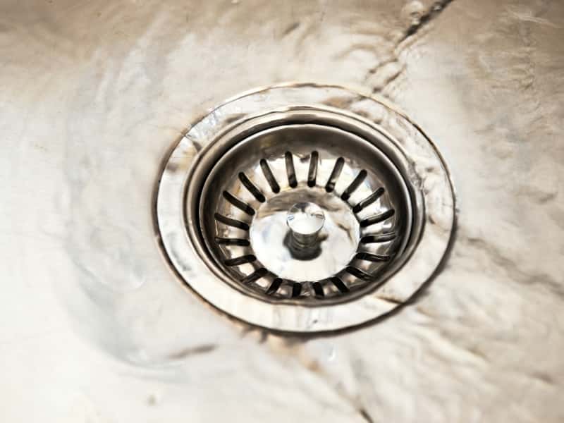 replacing a strainer basket in a kitchen sink